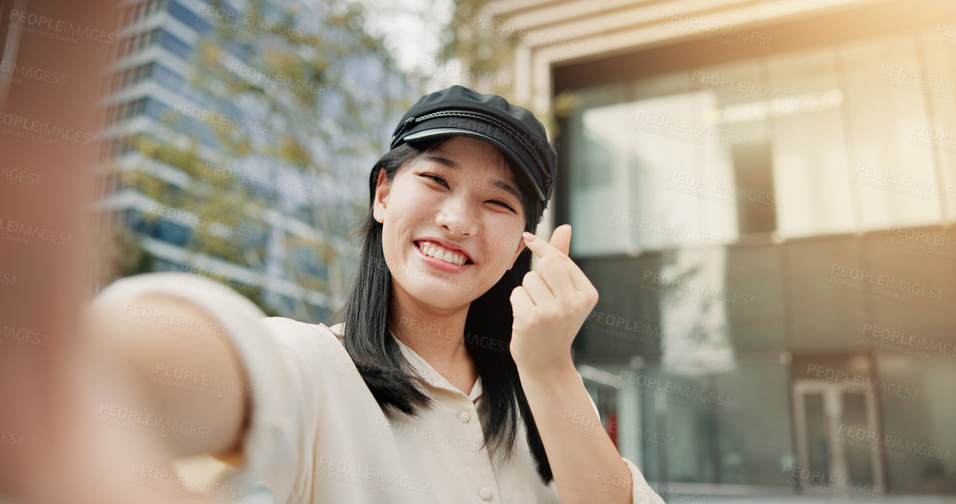 Buy stock photo Asian woman, portrait and selfie with finger heart in city for picture, photography or memory. Japan, female person or tourist with smile, love emoji or Kpop culture for capture moment in urban town