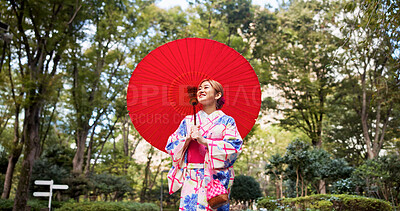 Buy stock photo Park, umbrella and Japanese woman with fashion, sightseeing and urban travel with trees. Path, kimono and parasol with walking, outdoor and journey with smile, style and traditional Asian dress