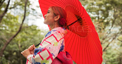 Buy stock photo Park, umbrella and woman with fashion, thinking and travel with smile in woods. Forest, kimono and parasol with walking, outdoor and journey with morning, style and traditional Asian dress in nature