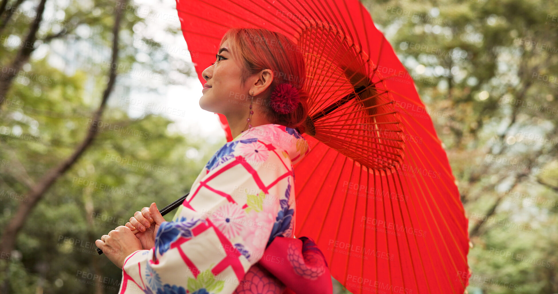 Buy stock photo Park, umbrella and woman with fashion, thinking and travel with smile in woods. Forest, kimono and parasol with walking, outdoor and journey with morning, style and traditional Asian dress in nature