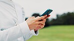 Person, hands and typing with phone at park for communication, chat or online app in nature. Japan, closeup or user on mobile smartphone for texting, message or browsing network or web for sport tips