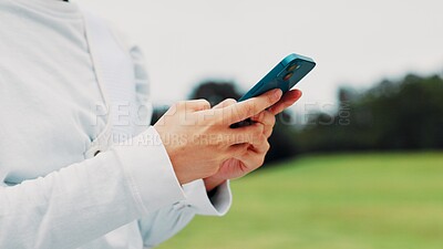 Buy stock photo Person, hands and typing with phone at park for communication, chat or online app in nature. Japan, closeup or user on mobile smartphone for texting, message or browsing network or web for sport tips