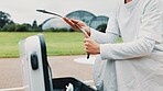 Bow, person and hands of archer with gear for training, field or preparing for competition, equipment and game. Contest, athlete and practice in tournament with bag, challenge and sports in Japan