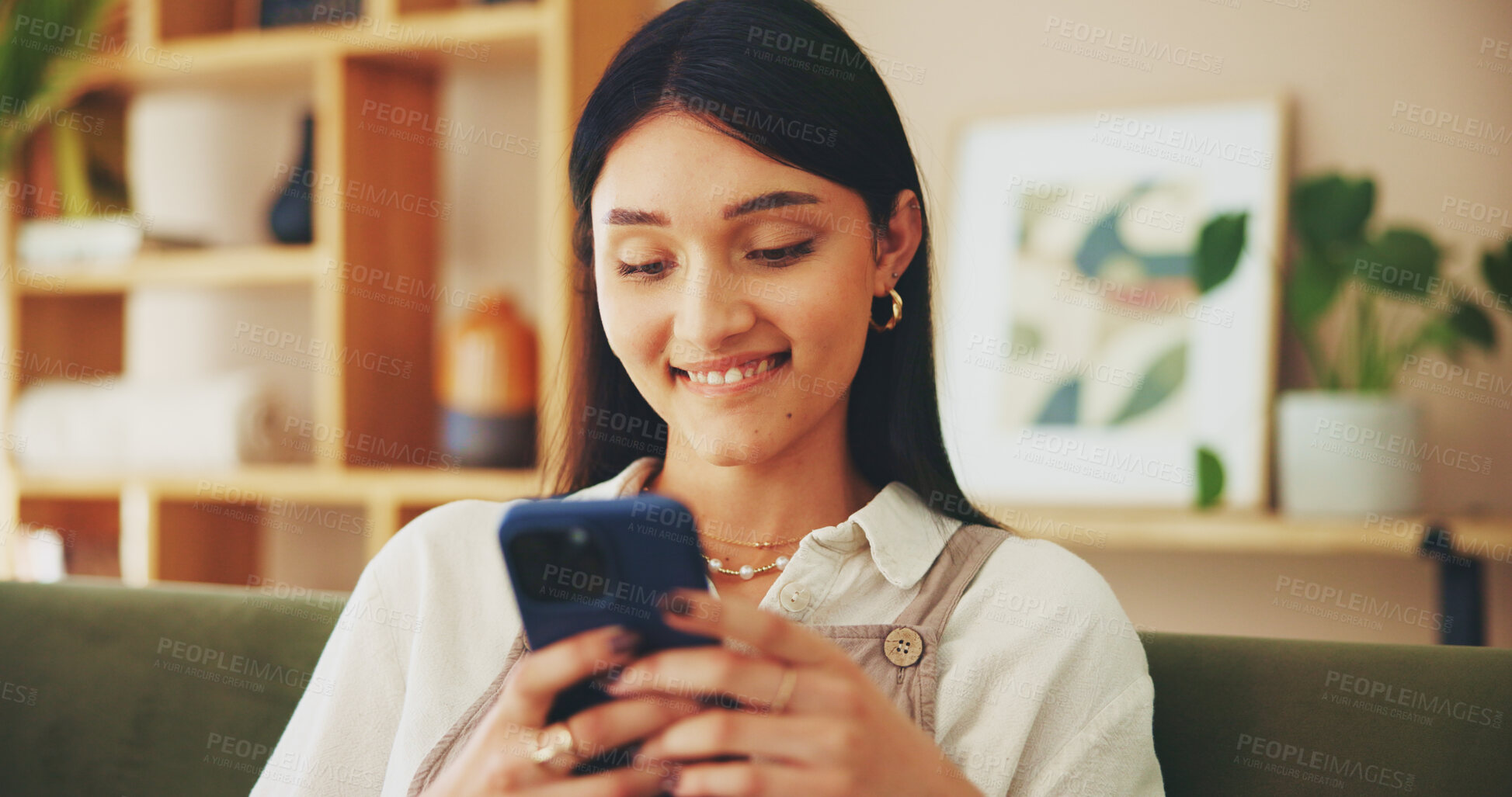 Buy stock photo Relax, phone and smile with woman on sofa for streaming, social media and networking app. Connection, online news and internet with person in living room at home for mobile, web and communication 