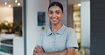 Portrait, woman and confidence as physiotherapist in gym, rehabilitation clinic or wellness practice. Female person, pride and arms crossed with smile, personal trainer or coach for physio exercise