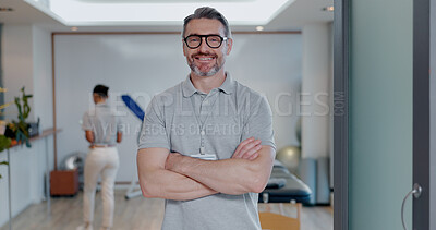 Buy stock photo Portrait, happy man and confidence as physiotherapist in gym, rehabilitation clinic or wellness practice. Male person, pride and arms crossed with smile, personal trainer or coach for physio exercise