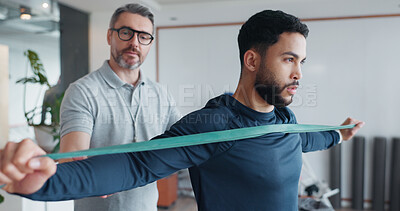Buy stock photo Physiotherapy, resistance band and stretching with man and athlete in clinic for rehabilitation, healthcare or consulting. Support, medical and muscle with people for healing, advice or recovery