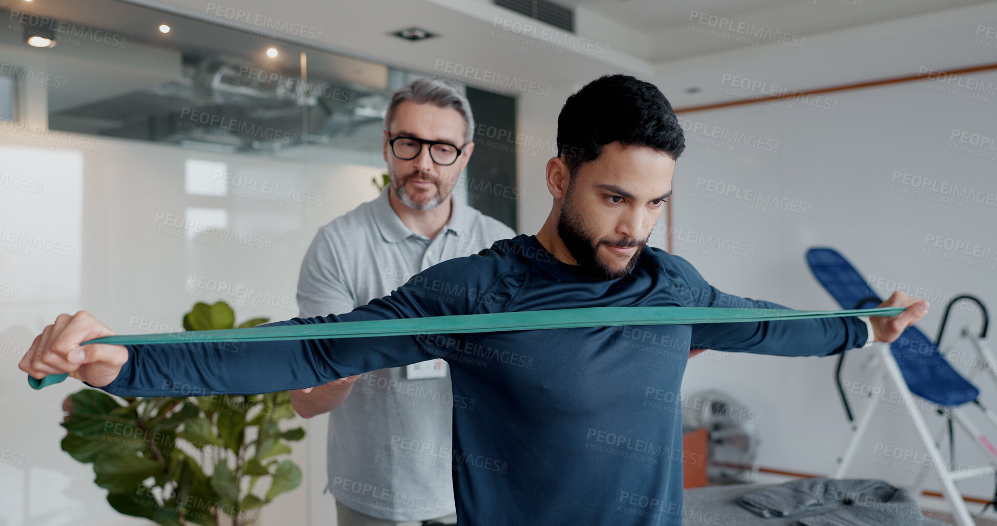 Buy stock photo Physiotherapy, resistance band and helping with man and athlete in clinic for rehabilitation, consulting or stretching. Healthcare, medical and muscle with people for healing, advice or recovery