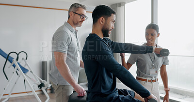 Buy stock photo Physiotherapy, consulting and dumbbell with man in clinic for medical, muscle performance and track progress. Rehabilitation, healthcare and training with people for chiropractor, help and healing