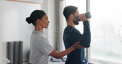 Buy stock photo Health, man and woman in physiotherapy with dumbbell for fitness, muscle workout or exercise. Rehabilitation, physiotherapist and patient in office together for help, strength or mobility training