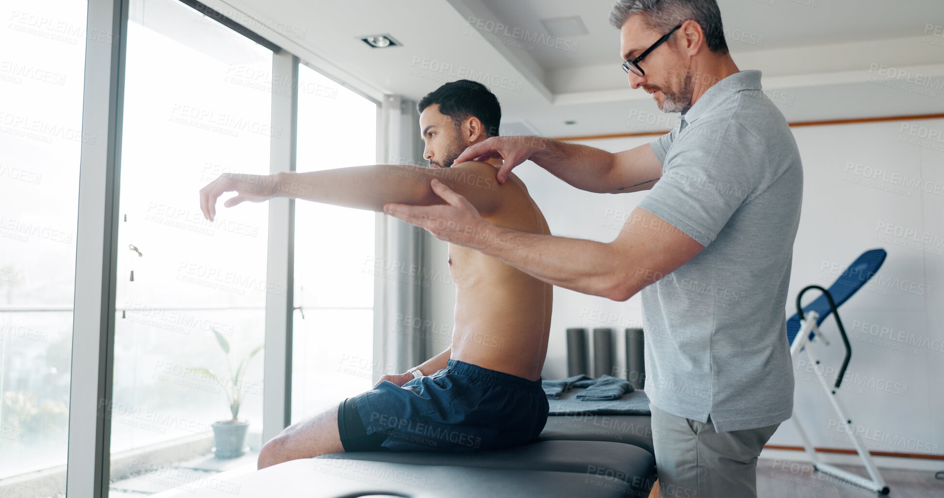 Buy stock photo Physiotherapy, consulting and shoulder with man in clinic for medical, muscle performance and track progress. Rehabilitation, healthcare and advice with people for chiropractor, help and healing