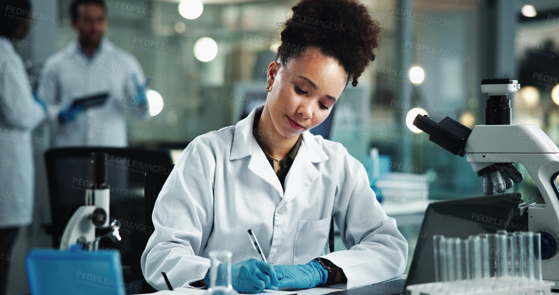 Buy stock photo Scientist, woman and writing chemical report for biochemistry, experiment and pathology breakthrough. Laptop, biotechnology and microscope for DNA inspection, pharmaceutical development or study