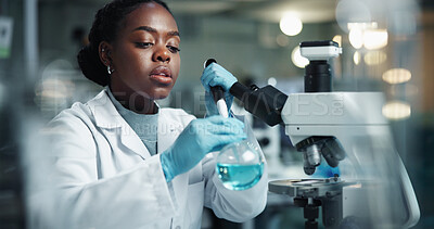 Buy stock photo Scientist, black woman and beaker with microscope for biochemistry, experiment and pathology research. Chemical, analysis and pipette for liquid inspection, pharmaceutical development and DNA study