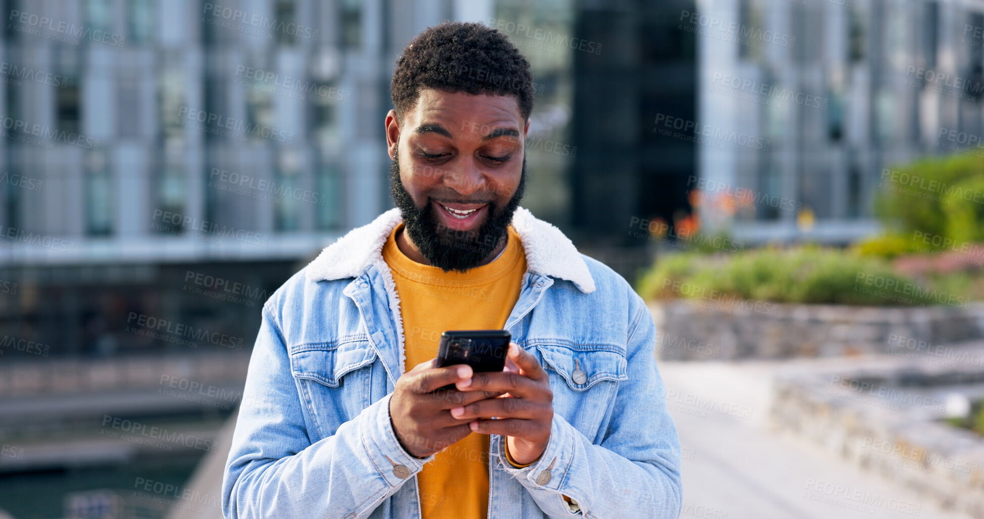 Buy stock photo Phone, happy and black man in city typing for communication, networking or contact with mobile app. Tech, travel and male person with smile on social media with cellphone outdoor in town for texting