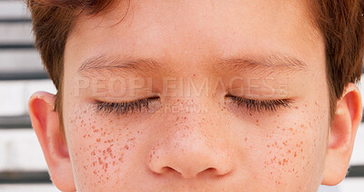 Buy stock photo Boy child, skincare and freckles for spf, sunscreen and outdoor as wellness, melasma and cosmetics. Young person, face and closeup as summer vacation, eyes closed and protection with dermatology