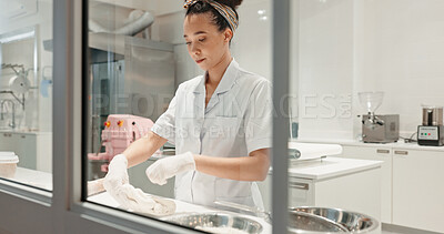 Buy stock photo Cooking, bakery and dough with woman in kitchen for coffee shop, food industry and meal prep. Chef, dessert and nutritionist with baker in restaurant for pastry recipe, small business and flour
