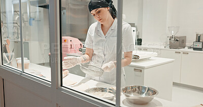 Buy stock photo Flour, bakery and sift with woman in kitchen for coffee shop, cooking industry and meal prep. Chef, dessert and nutritionist with baker in restaurant for pastry recipe, small business and food