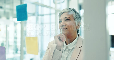 Buy stock photo Brainstorming, glass wall and mature businesswoman with creative planning with notes in office for project. Thinking, board and female event designer work on startup ideas for research in workplace.