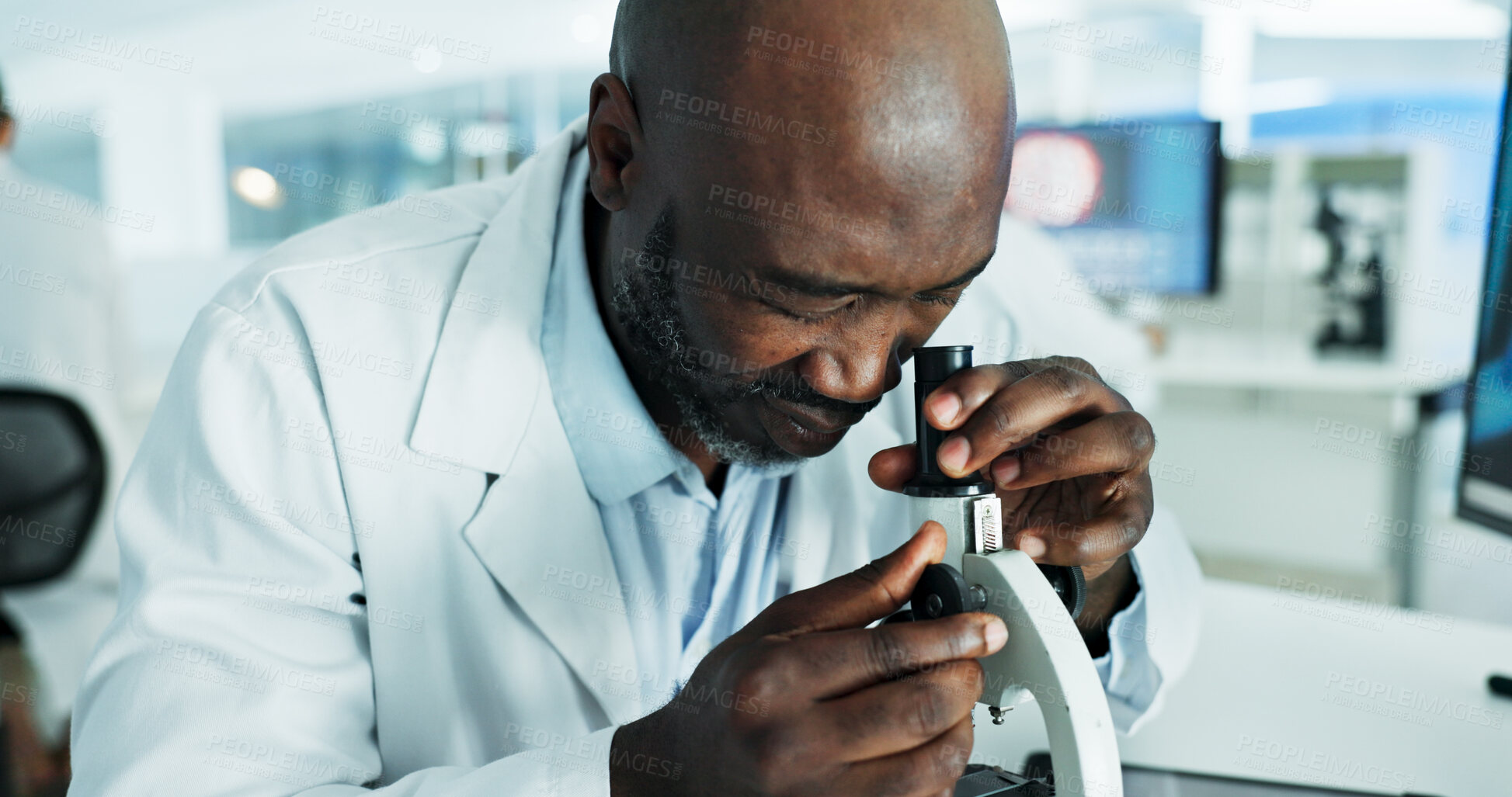 Buy stock photo Black man, scientist and microscope at laboratory with discovery for medical or scientific study. Male person, employee and serious with analyzing or test bacteria, virus and dna experiment