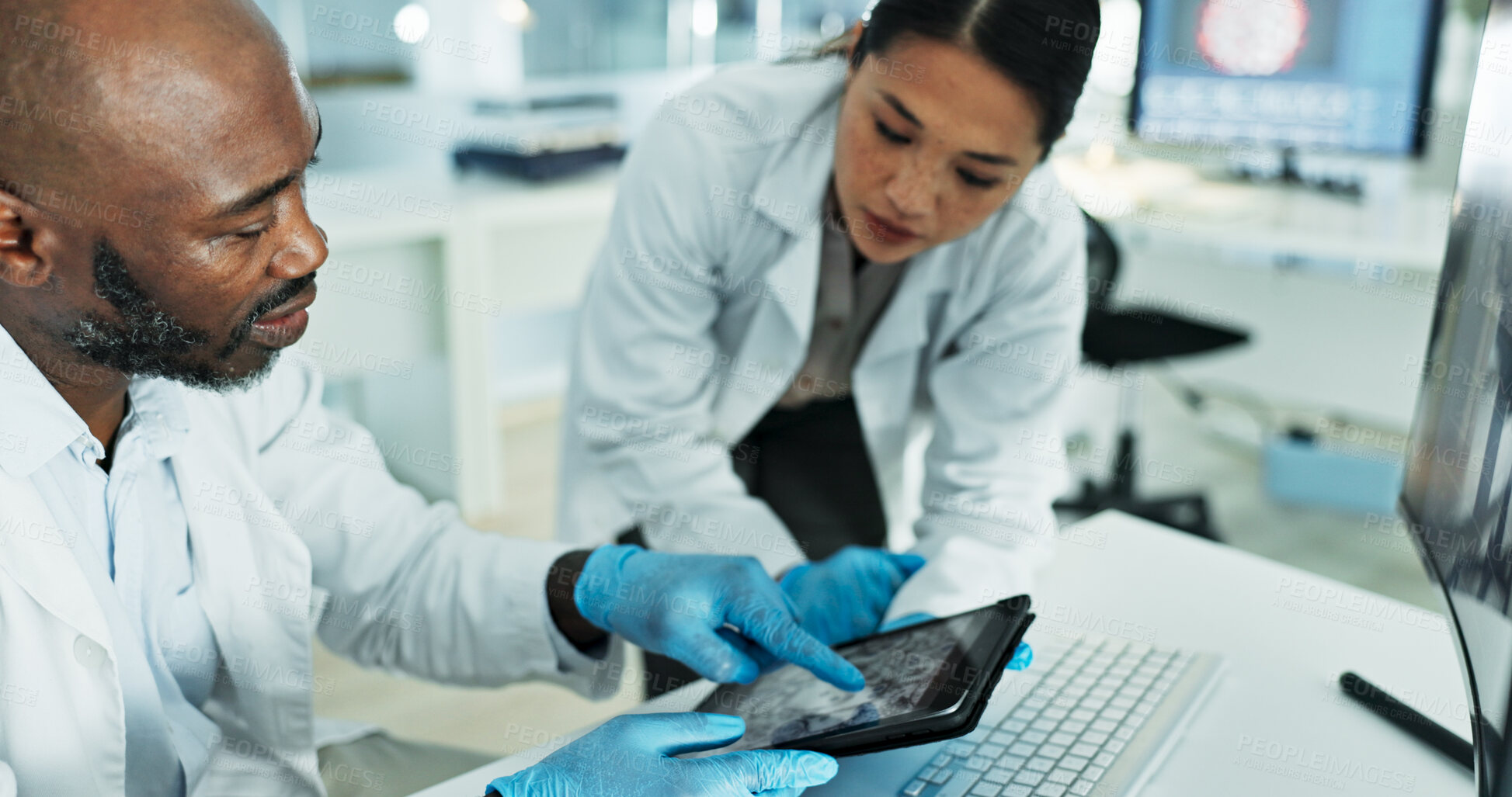 Buy stock photo Science, team and tablet in lab for discussion, brainstorming and innovation for medicine development. Scientists, man pointing or tech at desk for investigation, neuroscience or brain scan on screen
