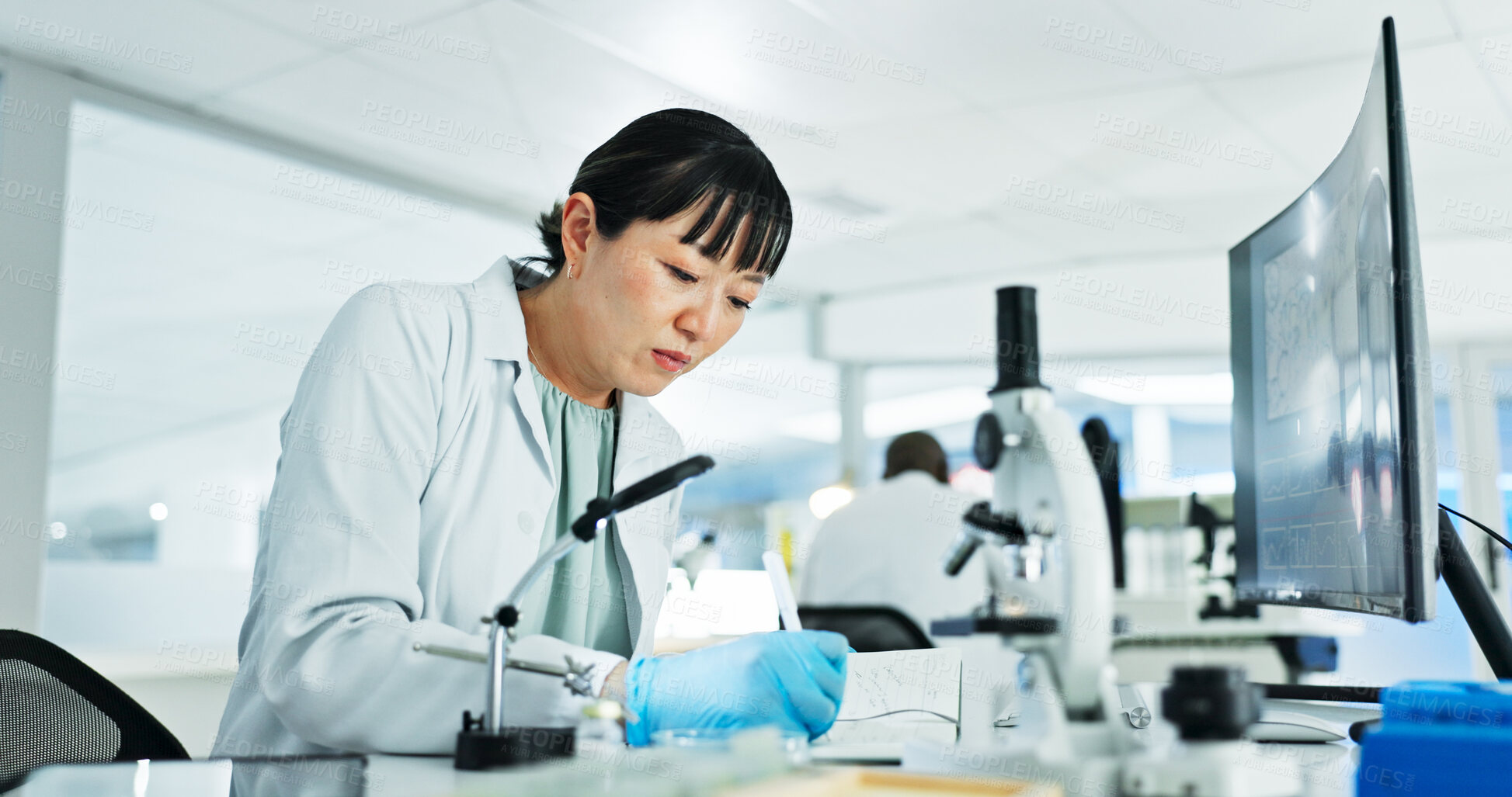 Buy stock photo Scientist, woman and research notes with computer, notebook and sample preparation in laboratory. Biochemistry, microscope and solution with technician for DNA study, genetic innovation or results