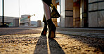 Business, walking and feet of woman in city with sunrise, travel and metro station for transport. Urban, sidewalk and shoes of professional businesswoman on morning commute with high heels on ground