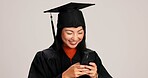 Woman, studio background and happy for graduation on smartphone with text message for congratulations. Asian person, university student and smile or excited for social media, communication and chat