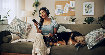 Buy stock photo Woman, headphones and dog for music in home, surfing audio website and online for playlist search. Female person, hearing podcast and app for communication on couch, pet care and internet for sound