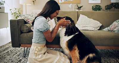 Buy stock photo Home, happy and woman with dog, relax and owner with loyalty for companion, lounge and care in apartment. Living room, chilling and bonding with pet, person and comfortable with animal in house