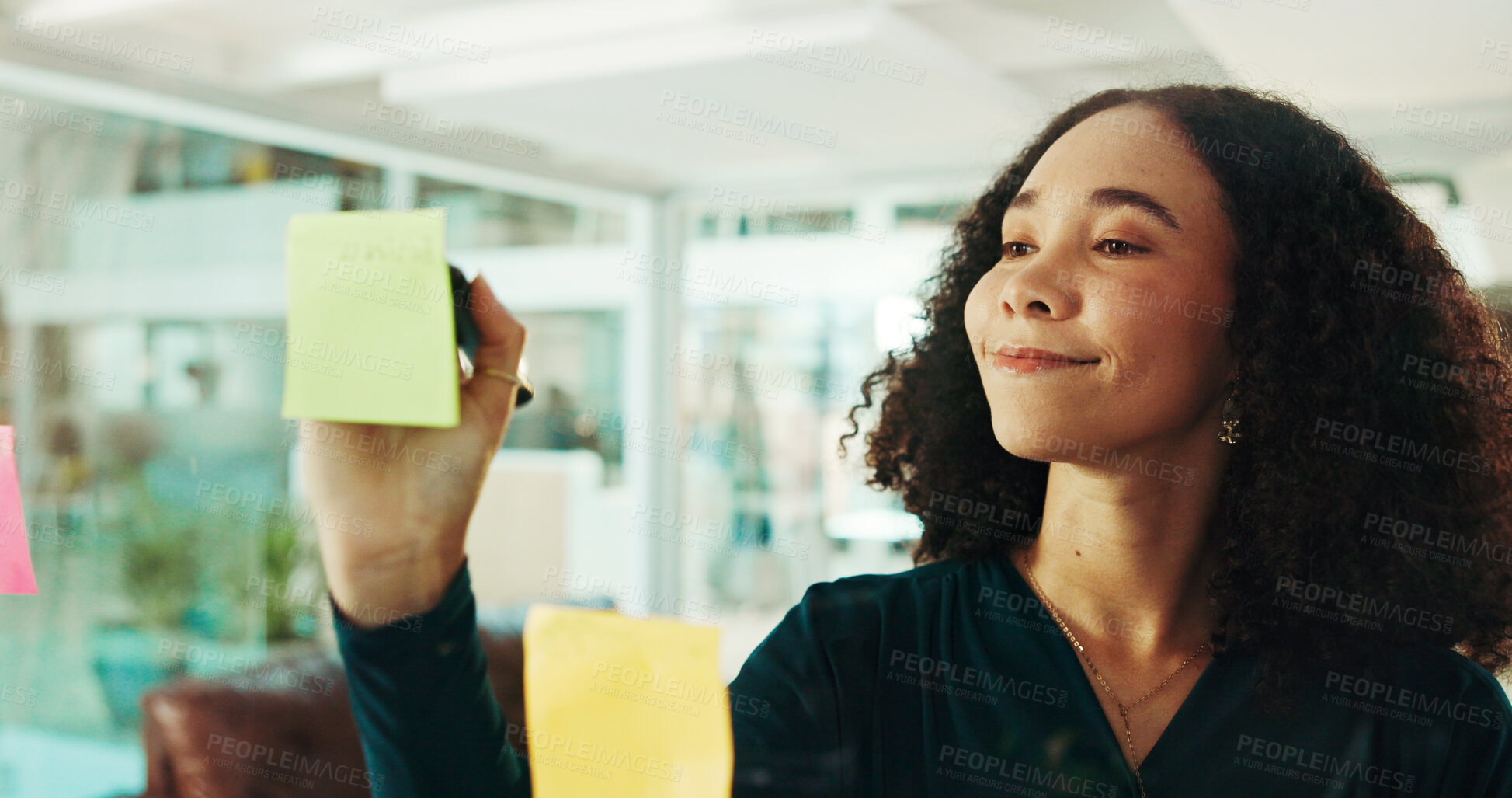 Buy stock photo Happy woman, writing or schedule planning with glass board for tasks, agenda or reminder at office. Female person, thoughtful or business employee with sticky notes for idea, project or brainstorming