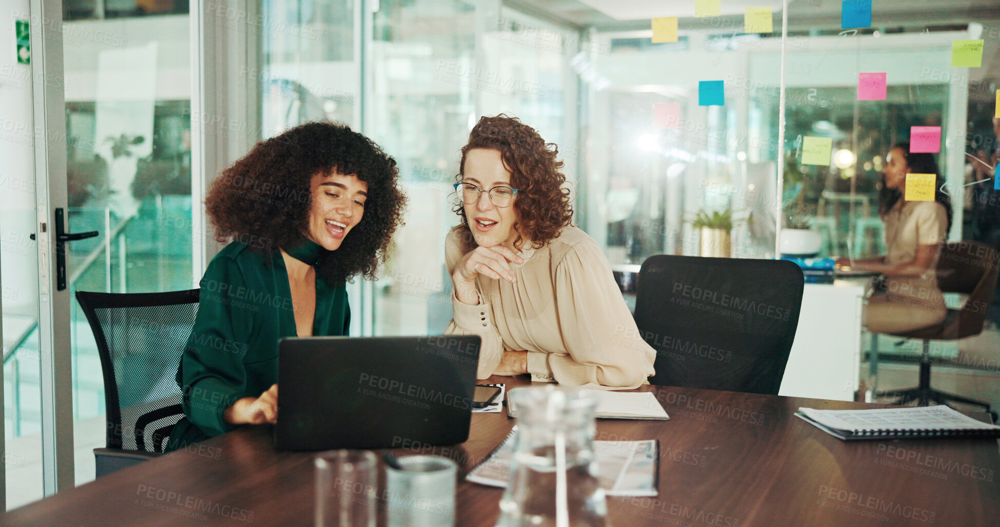 Buy stock photo Business women, laptop and discussion with project planning for strategy, schedule or report at office. Female people, employees or colleagues with smile on computer for brainstorming at workplace