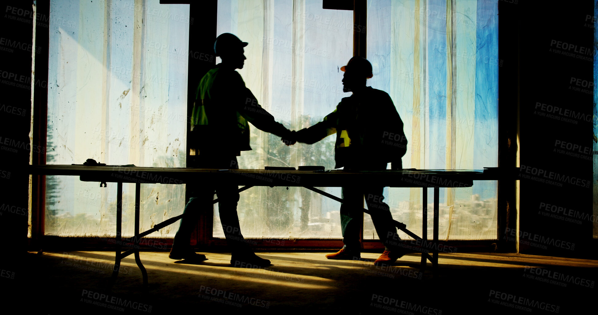 Buy stock photo Architecture, handshake and silhouette of people on construction site for building, teamwork or deal. Hiring, real estate and property developer with contractor, engineer and renovation agreement