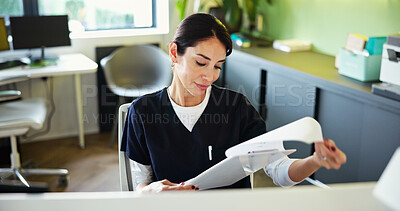 Buy stock photo Clinic, receptionist and woman with documents for medical service, appointment and administration. Healthcare, hospital and dental assistant at front desk for patient info, schedule or insurance form