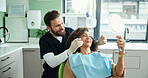 Dentist, smile and woman with mirror to check for consulting, teeth whitening and wellness. Healthcare, dentistry and man with patient for dental hygiene, oral cleaning and medical services in clinic