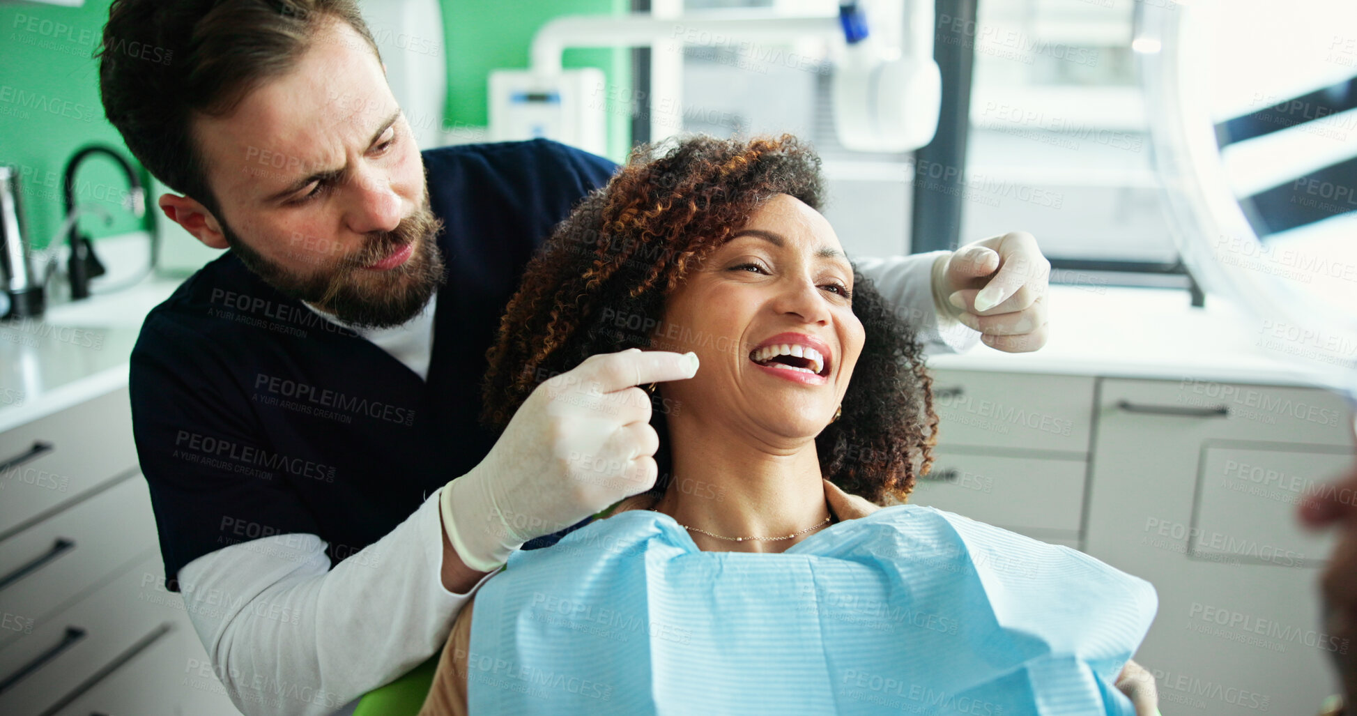 Buy stock photo Dentist, big smile and man with woman with mirror for consulting, teeth whitening and wellness. Healthcare, dentistry and patient for dental hygiene, oral cleaning and medical services in clinic