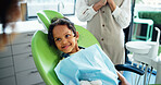 Dentist, consulting and child on chair happy for cleaning, tooth extraction and wellness. Healthcare, dentistry and young patient with hygienist for dental hygiene, oral care and medical services