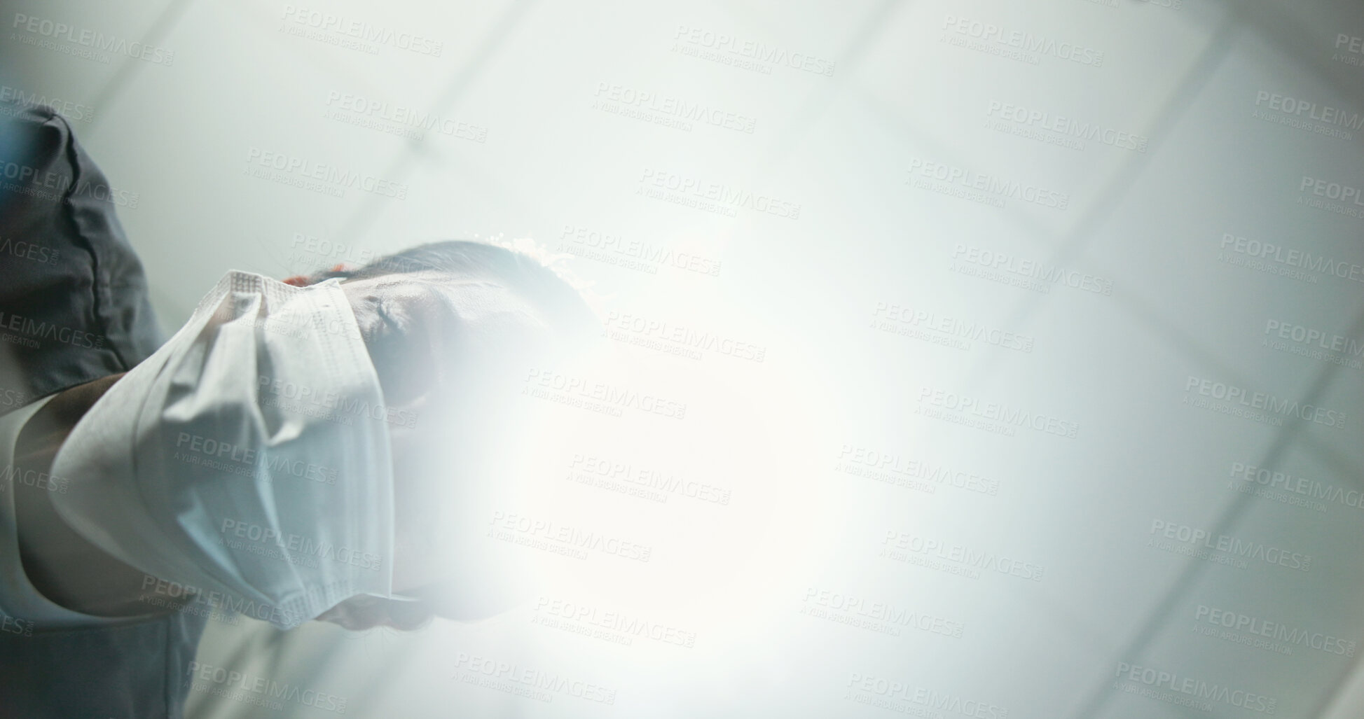 Buy stock photo Dentist, face mask or surgery below with light for dental hygiene, cleaning or cavity removal at hospital. Lens flare, low angle and medical orthodontist with patient for oral, mouth or gum care exam