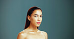 Portrait, skincare and confident woman with beauty, glow and natural aesthetic on studio background space. Face, serious and model in makeup cosmetics for dermatology, shine and spa facial treatment