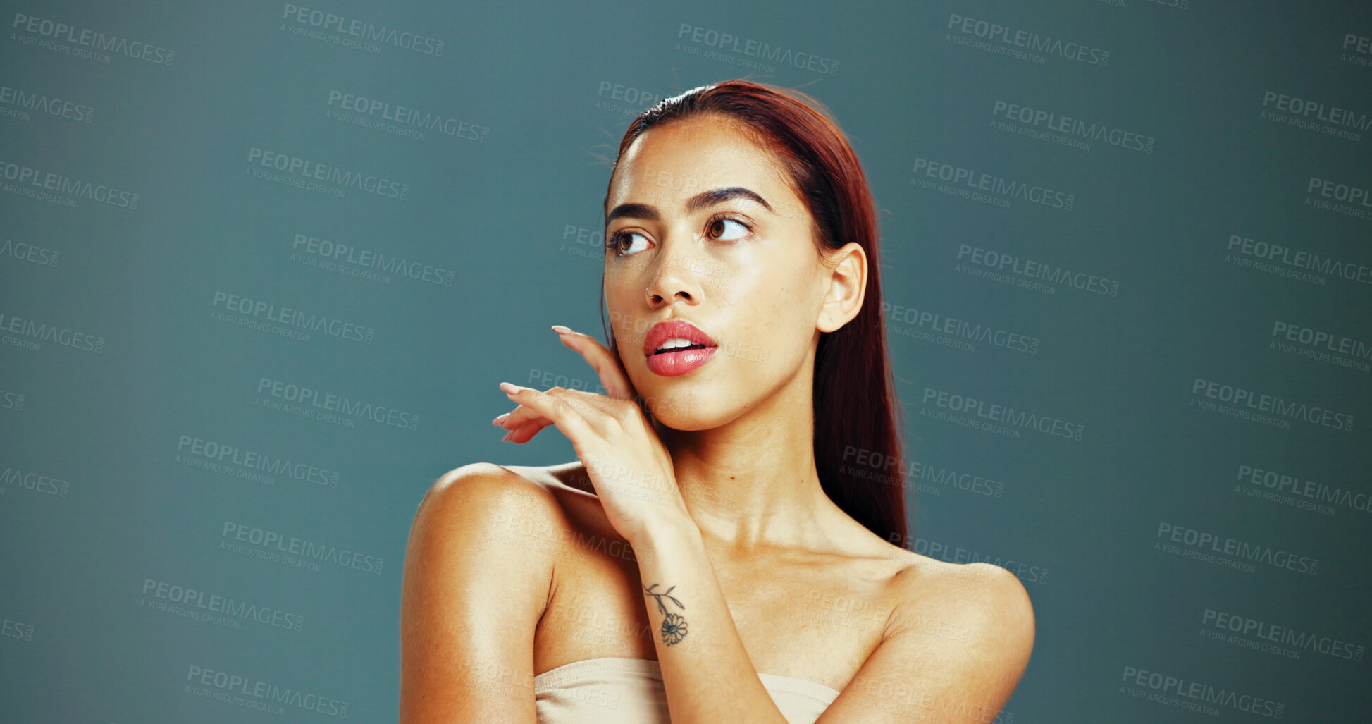 Buy stock photo Beauty, skincare and woman in studio thinking for wellness, health and facial treatment. Dermatology, spa and isolated person with cosmetics for natural texture, salon and shine on blue background