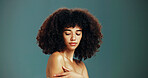 Beauty, proud and woman with afro hair care, studio and treatment for wellness and health. Face, shoulder or confident girl model with skin, growth and natural texture on green background in Brazil