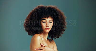 Buy stock photo Beauty, glow and woman with afro hair care, studio and treatment for wellness and health. Face, shoulder or confident girl model with skin, growth and natural texture on green background in Brazil