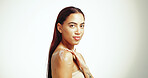 Portrait, skincare and woman with beauty cream for glow, aesthetic and hydration white on studio background space. Face, lotion and model apply cosmetics on shoulder for dermatology or moisturizer