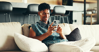 Buy stock photo House, relax and man on sofa, smartphone and typing with social media, connection and network. Apartment, person and guy on couch, cellphone and message to contact, digital app and texting in lounge