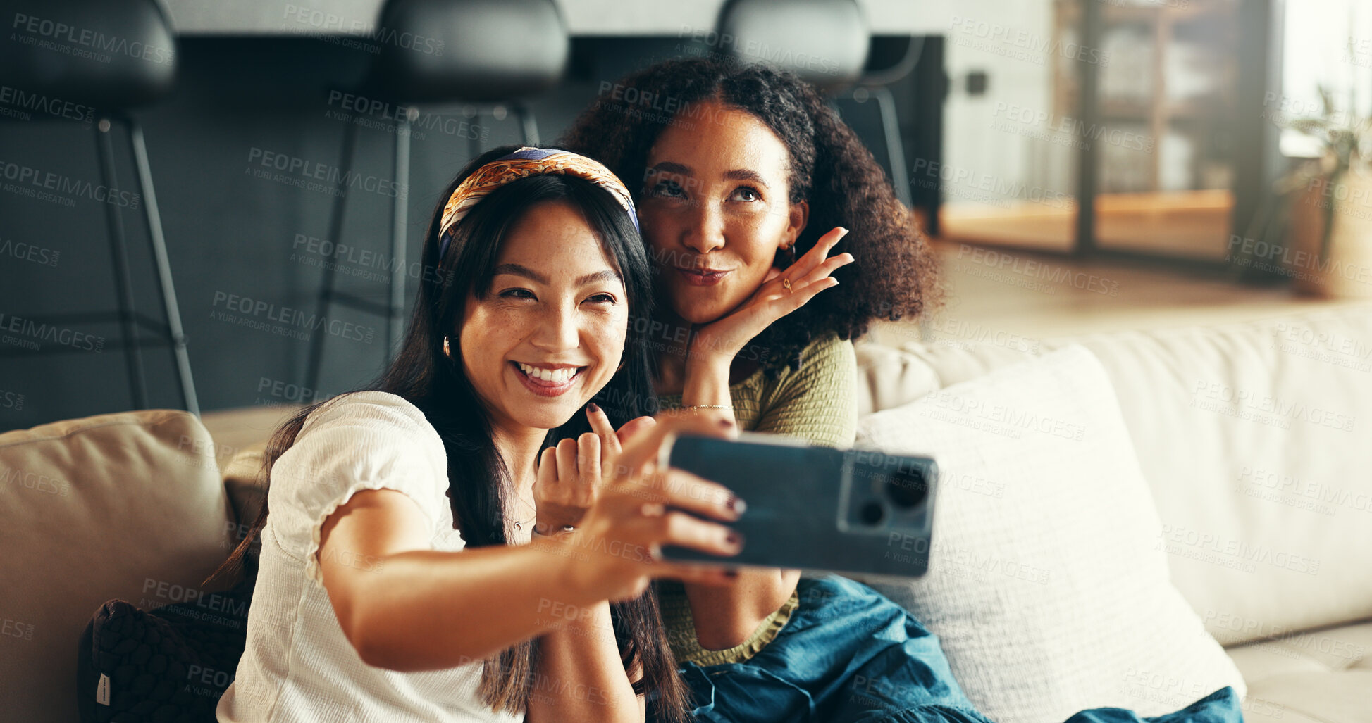Buy stock photo Women, friends and happy in home for selfie, weekend visit and making memories for social media. People, reunion and excited in living room with photography, heart fingers and connectivity for update