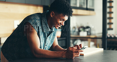Buy stock photo Smile, typing and man in kitchen with phone for social media meme, online chat or search on website. Smartphone, scroll and happy person in home with mobile app for communication, networking or text
