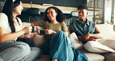 Buy stock photo Bonding, relax and friends with coffee, home and smile for gossip, couch or drinks in living room. Happy, conversation and talking in lounge, tea and together in weekend, listening or people in house