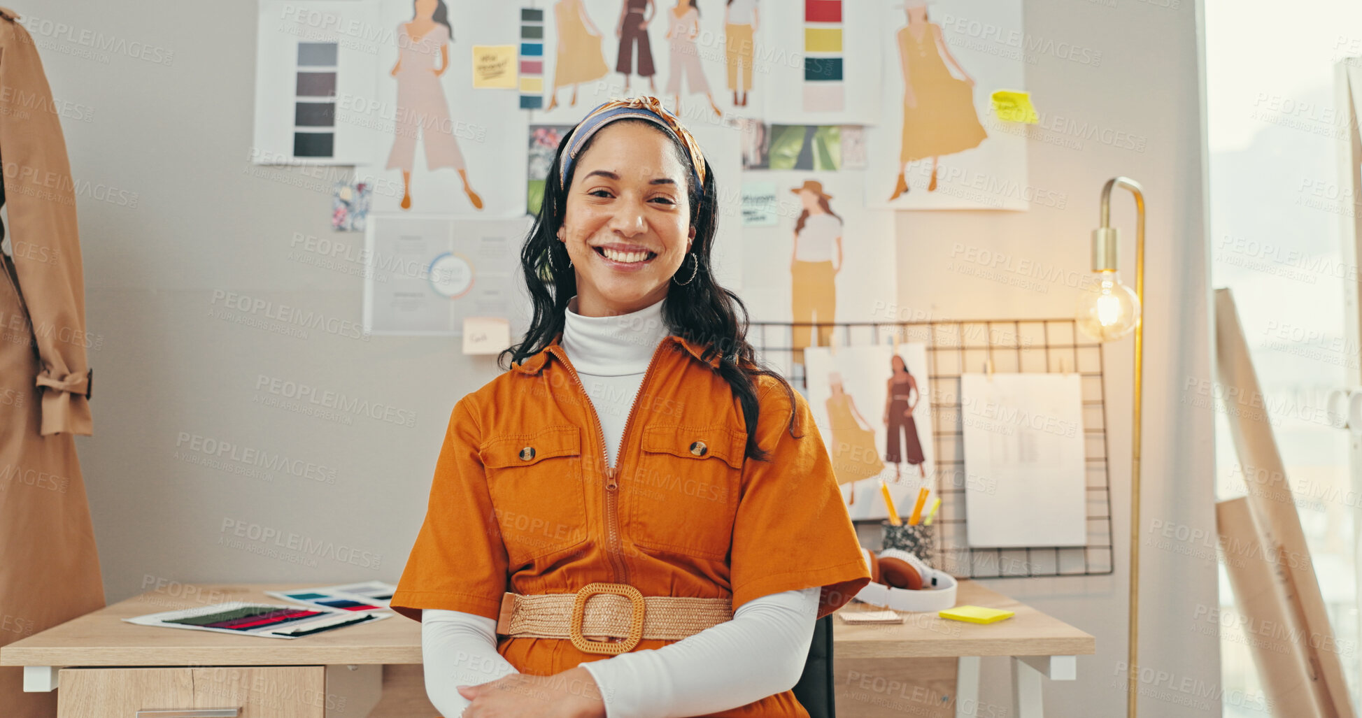 Buy stock photo Creative, portrait and smile with fashion designer woman in textile workshop for small business. Desk, drawings and wall with happy style director in office for clothes production or manufacturing