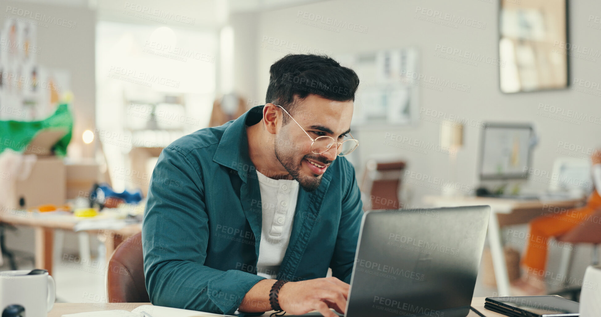 Buy stock photo Business, man and fashion designer happy on laptop at office for online orders, delivery and supply chain. Male person, entrepreneur and website for workshop management with textiles and logistics