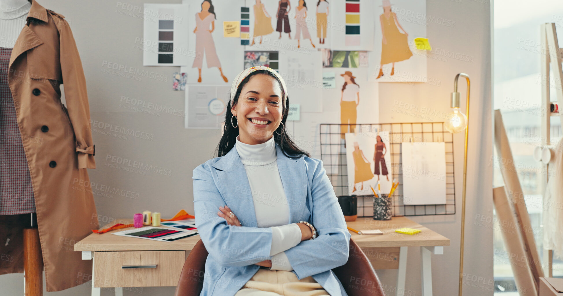 Buy stock photo Arms crossed, creative and portrait of fashion designer woman in textile workshop for production. Clothes, confident and wall with happy style director at desk in office for manufacturing process