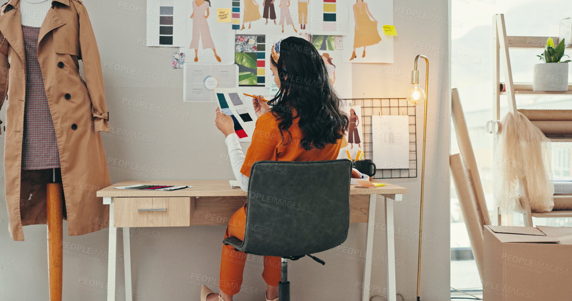 Buy stock photo Choice, color palette and creative with fashion designer woman in textile workshop from back. Clothing industry, decision and wall with style director at desk in office for clothes manufacturing